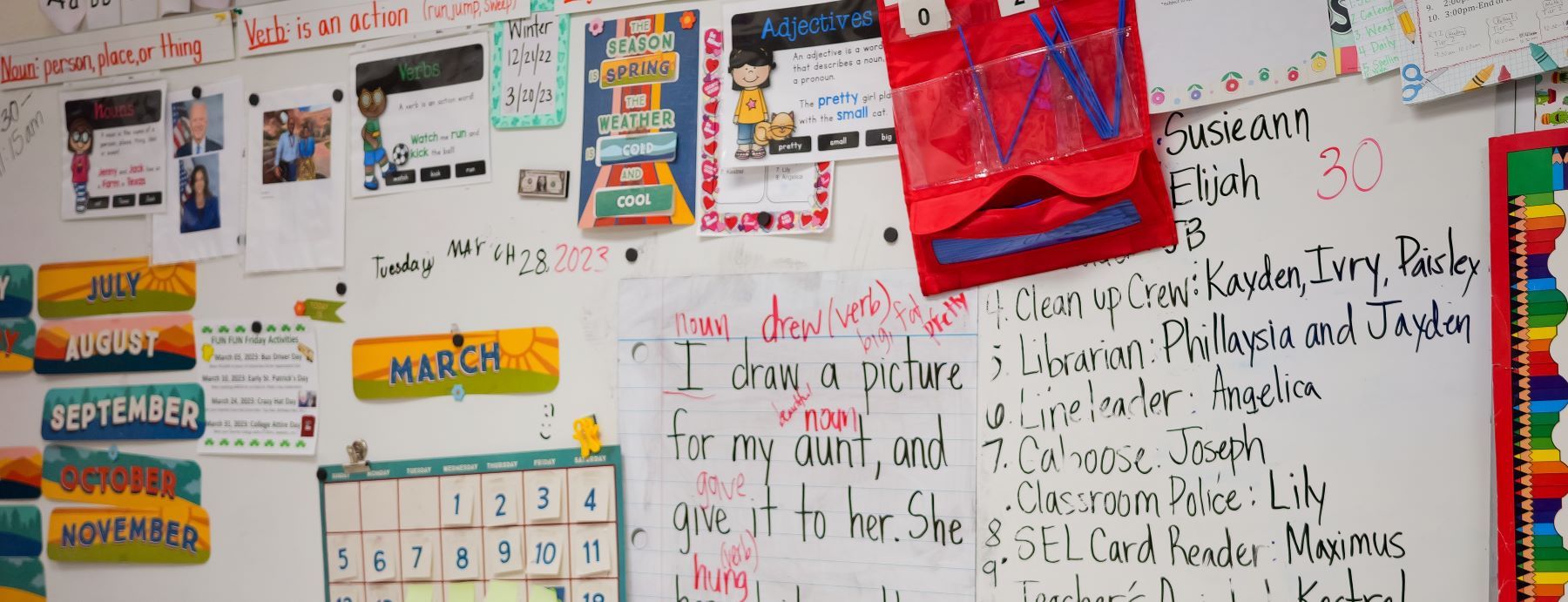 Classroom board with schedules and projects.