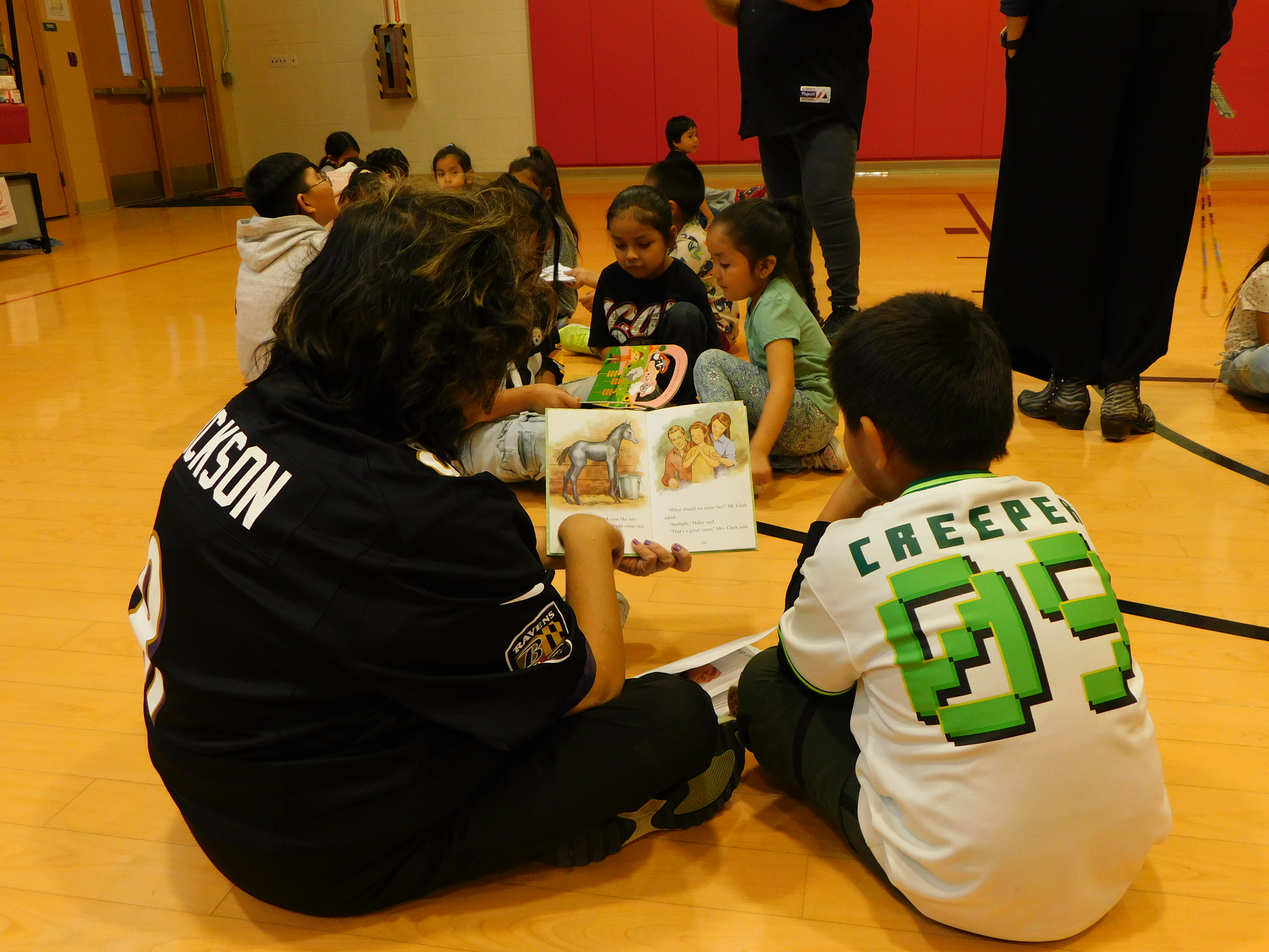 NLC teacher reading to Kindergarten 