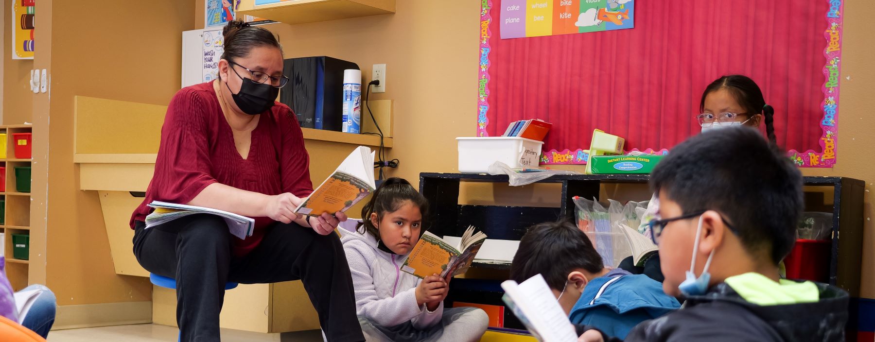 teacher and students reading in class